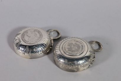 null Suite of two silver wine tastes of Burgundy type, with embossed decoration of...