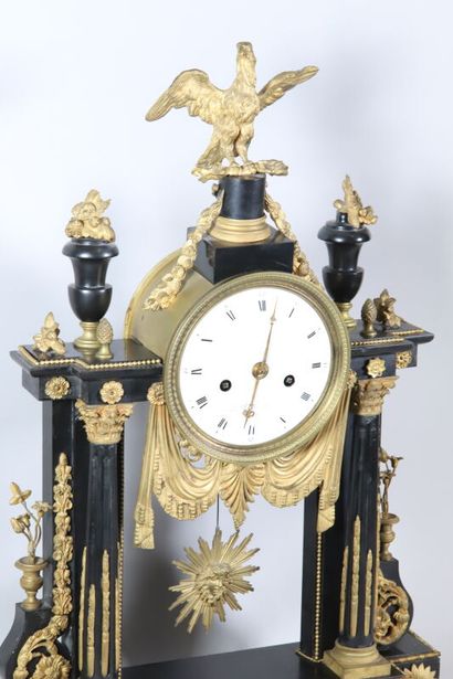 null Portico clock in black marble and gilt bronze trim, the round white enamelled...