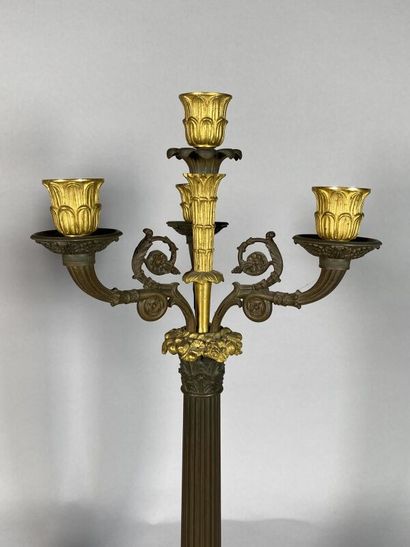 null Pair of candelabras with four lights in bronze with two patinas, the shaft in...