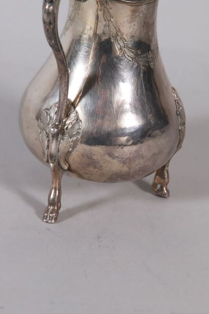 null Silver selfish coffee pot, the baluster body with engraved decoration of laurels...