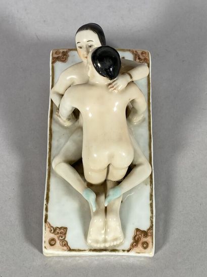null CHINA 
Erotic subject in polychrome enamelled porcelain on a base with golden...