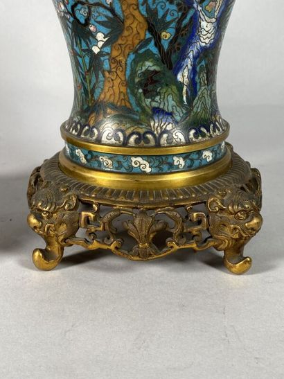 null CHINA, early 20th century
A pair of ormolu and cloisonné vases with flared necks...