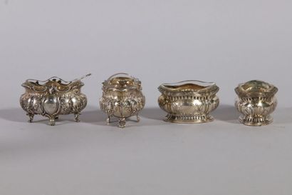null Suite of two pairs of salt bowls, repoussé decoration in the Louis XV style...