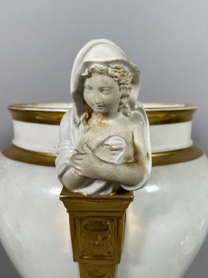 null Porcelain refreshment stand of baluster form resting on a pedestal, the handles...