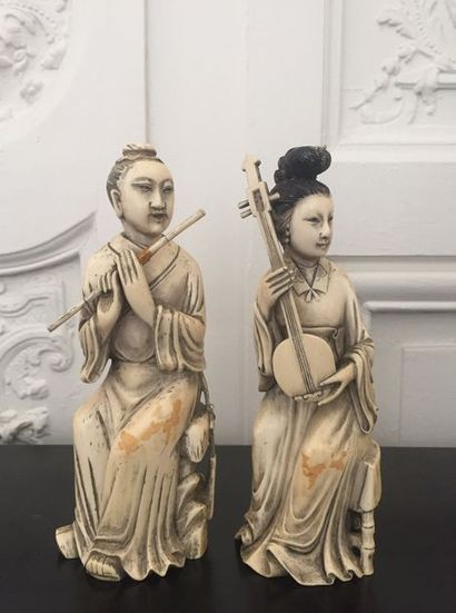 null CHINA Pair of ivory subjects representing musicians. Red stamp on the back....