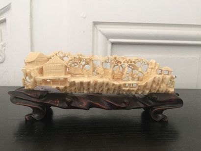 null CHINA Ivory group carved in a tusk decorated with animated scenes in the countryside....