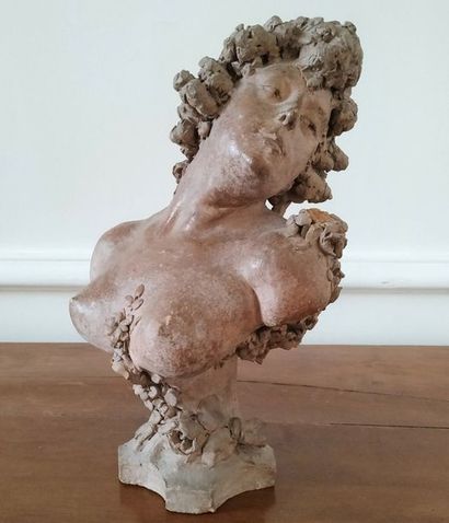 null Terracotta statue representing the bust of a young woman with a garland of flowers....