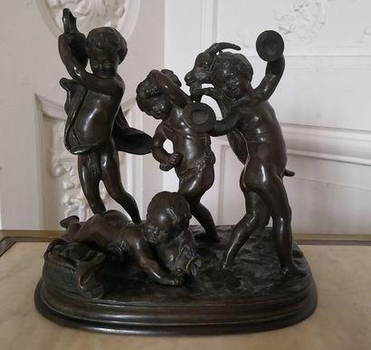 null D'après CLODION (1738-1814) Quatre Putti à la chèvre Groupe en bronze patiné,...