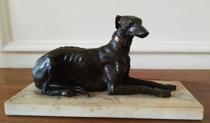 null GROUP in patinated bronze representing a greyhound lying on a rectangular base...