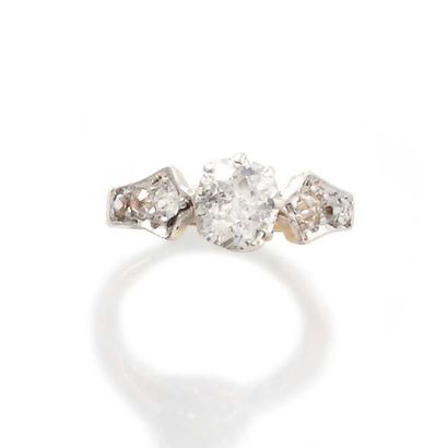 null RING in 750 thousandths yellow gold and platinum adorned with seven diamonds,...