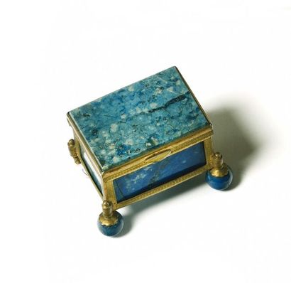 null Small rectangular box on four lapis lazuli balls. A gilded metal frame engraved...