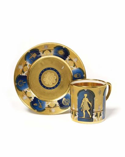 null PARIS Litron-shaped mug and its porcelain saucer with gold decoration of two...