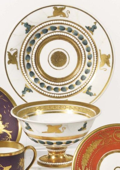 null Paris Coupe on pedestal and its porcelain saucer decorated in green and gold...