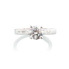 null SOLITAIRE RING 

in 750-thousandths white gold presenting a diamond certified...