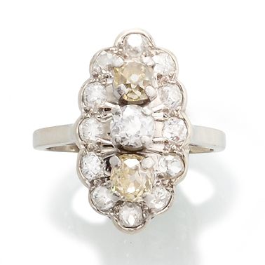 null MARQUISE RING 

in 750-thousandths white gold and platinum, polylobed, adorned...