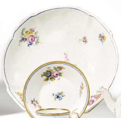 null VINCENNES Two round bowls with relief decoration of flowering branches and polychrome...