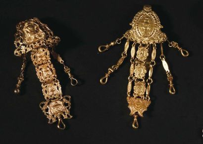 null BATCH OF TWO CHATELAINS in gilded metal with carved links in relief of vases...