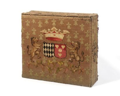 null A rectangular WOODEN COFFER covered with a tapestry decorated with an alliance...