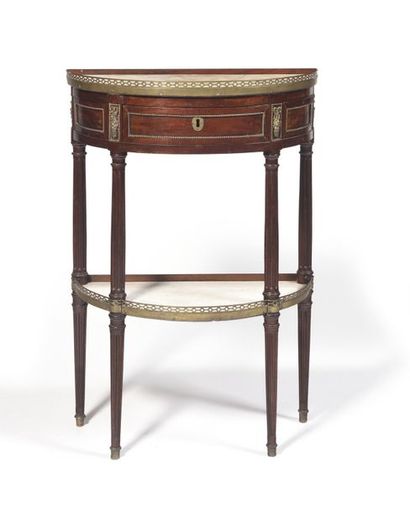 null A mahogany CONSOLE in the shape of a half-moon, opening to a drawer and resting...