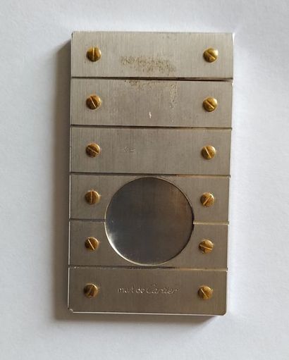 null CARTIER Must "Santos Collection" cigar cutter in studded steel. Signed and numbered...