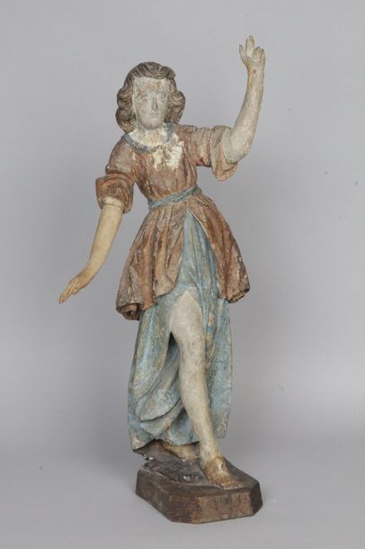 null FRANCE, début XVIIe siècle STATUETTE D’ANGELOT en bois sculpté polychrome. (Socle...