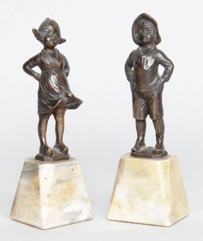 null J.H. LAND, 20th century PAIR OF BRONZE STATUTES depicting a girl with her hands...