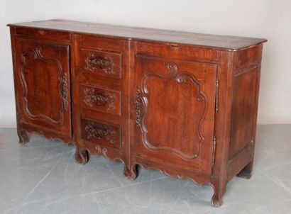 null BUFFET ENFILADE made of natural wood paneled and moulded with windings. It has...