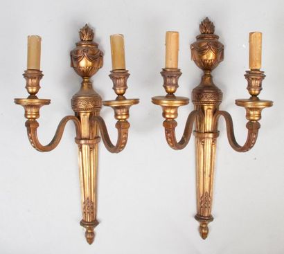 null Pair of Louis XVI style sconces in gilt bronze with two arms of light, decorated...