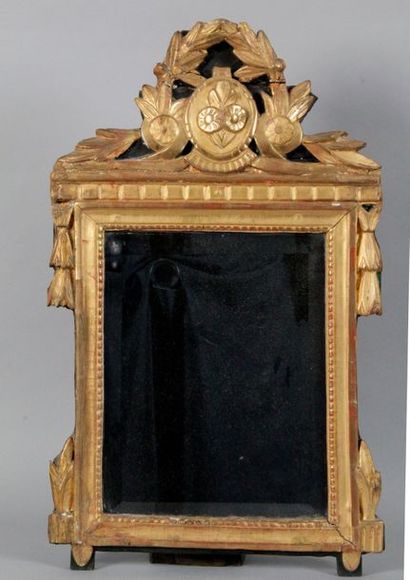 null Moulded and carved gilded wood pediment MIRROR with a laurel wreath flowers...