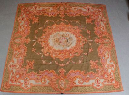 null AUBUSSON CARPET early 19th century. Green field decorated with a large central...