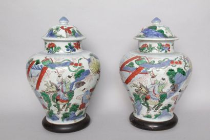 null CHINA: Two covered porcelain pots in baluster form decorated in polychrome "wucaï"...