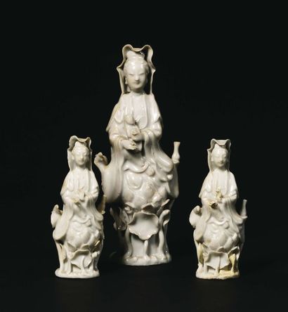 null CHINA STATUETTE in white Chinese porcelain representing a Guanyin holding a...