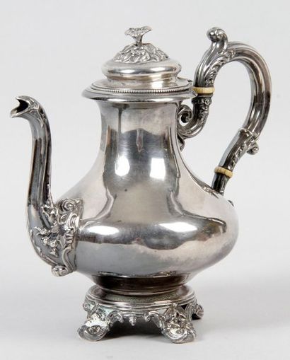null EGOISTIC teapot in the shape of a silver baluster resting on four small winding...