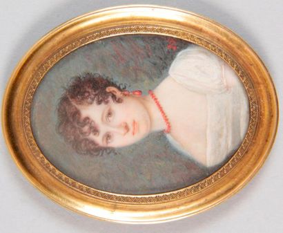 null FRENCH SCHOOL, early 19th century OVAL MINIATURE depicting a young woman wearing...