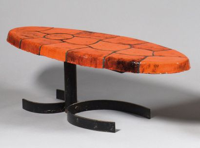 null ANDRE BORDERIE (1923-1998) Coffee table with oval top in thick orange ceramic...