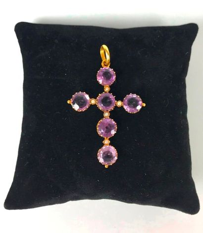 null Yellow gold cross decorated with six amethysts in closed setting alternating...