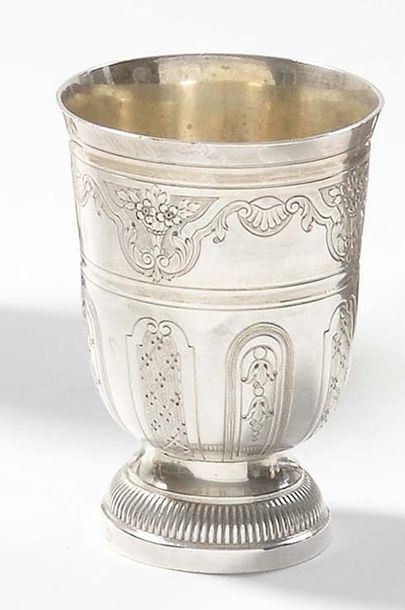 null A 950 thousandths silver tulip cup on a gadrooned pedestal decorated with reserves...