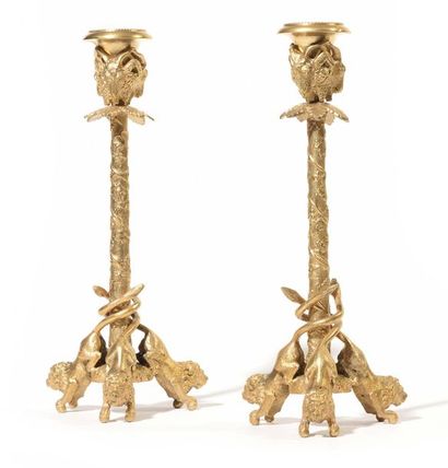 null Pair of small gilt bronze candelabra, decorated with ram's heads and foliage,...