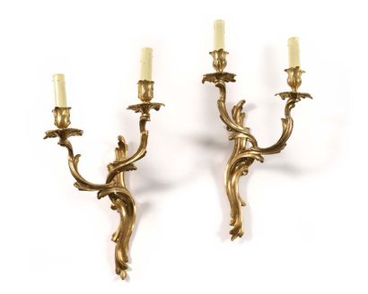 null Pair of gilt bronze sconces with two branches of light decorated with acanthus...