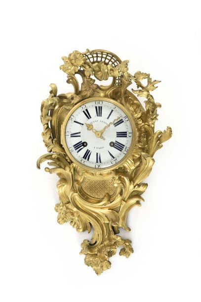 null Gilt bronze cartel with foliage, flowers and gloriette decoration, the dial...