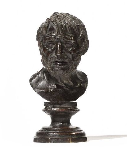 Small bronze bust with brown patina representing...