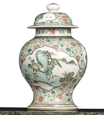 null CHINA Pair of porcelain covered baluster pots decorated in green family enamels...