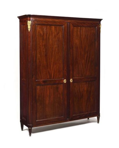 Moulded mahogany cabinet with two doors,...