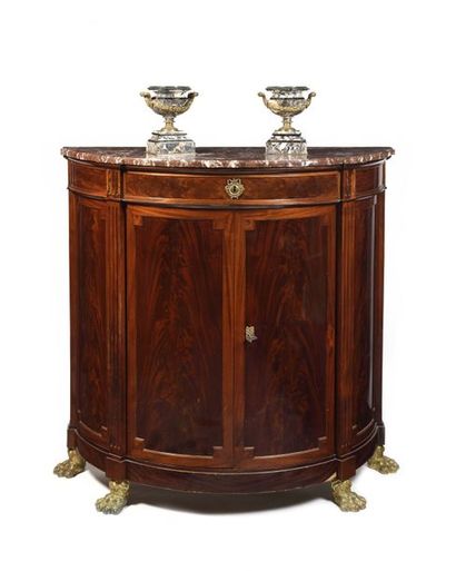null Half moon shaped flamed mahogany in-between piece of furniture, opening with...