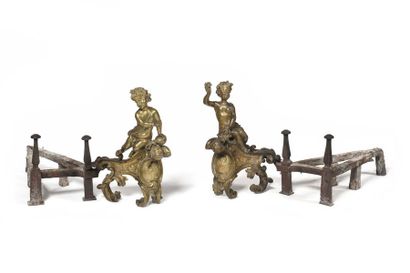 null Pair of ormolu bronze andirons decorated with children-bacchus resting on a...