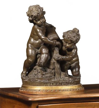 null Terracotta group patinated in imitation of bronze representing two putti playing...