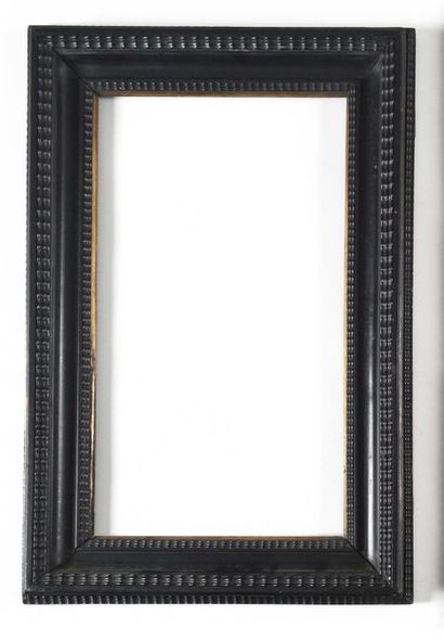 null Dutch blackened wooden frame with engraved decoration of foliage and tulips,...