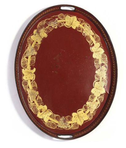 null Large oval tray, decorated on a red background with vine branches and a frieze...