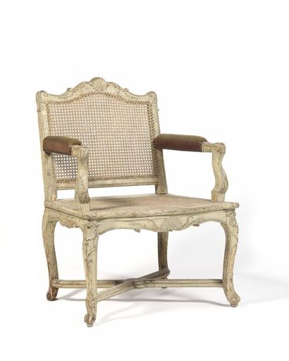 Caned and painted beech armchair with a flat...