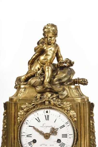 null Gilt bronze clock with openwork decoration of foliage scrolls, the dial with...